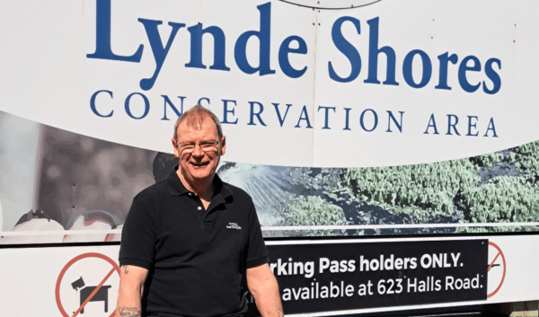 larry in front of Lynde Shores sign in Whitby