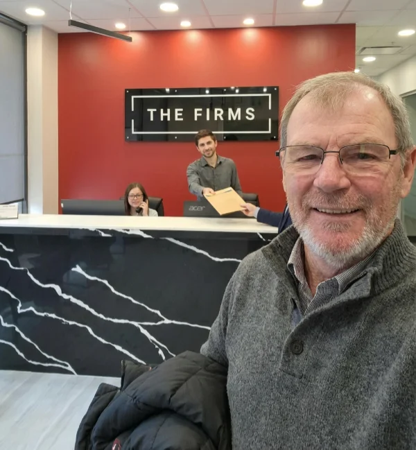 Man taking selfie at law firm reception