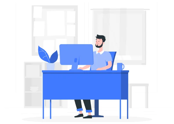 Person working at computer desk in office.